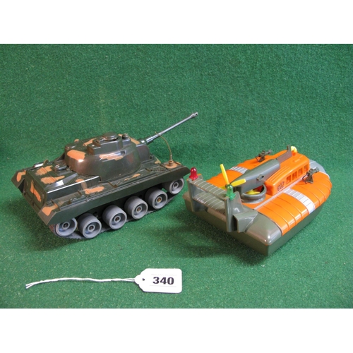 340 - Louis Marx & Co. Ltd Swansea: cap firing tank and military hovercraft, both battery operated, of met... 