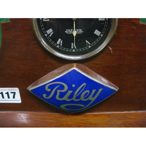 117 - Electric Jaeger car clock built into a Riley badged wooden mantle surround - 9