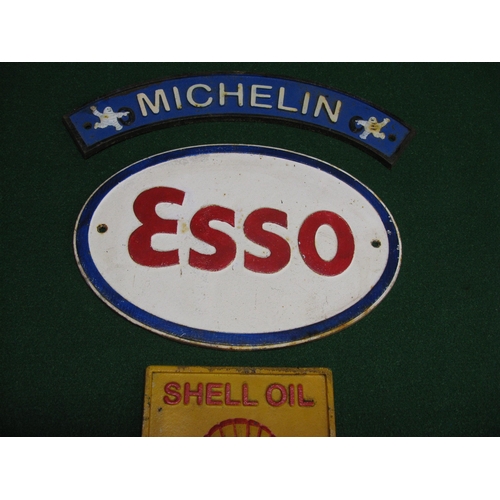 141 - Six modern cast iron reproduction signs for Shell, Esso and Michelin - widest 19.5