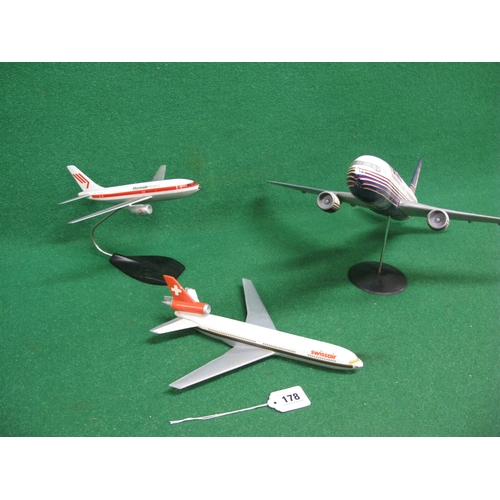 178 - Three plastic desktop airline models with two stands to comprise: 1:100 scale Boeing 767 in Britanni... 