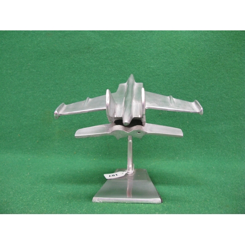 187 - Polished alloy desk ornament of a futuristic jet fighter, plane is 15