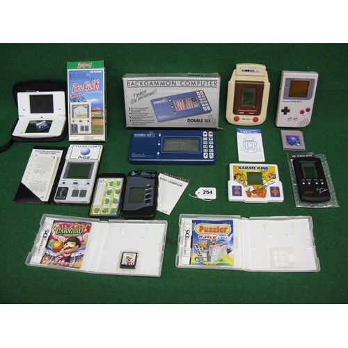 254 - Box of hand held computer games from Nintendo, Systema, Grandstand, Bandai, Hartung-Berlin etc