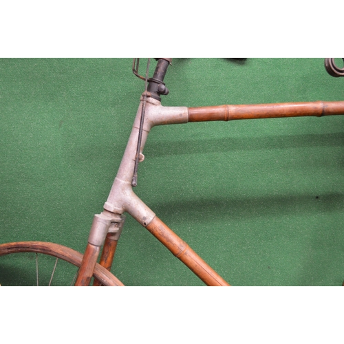 289 - Most unusual bicycle with bamboo tubing, wheel rims and mud guards, old leather saddle and remains o... 