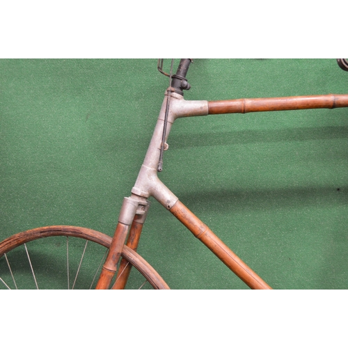 289 - Most unusual bicycle with bamboo tubing, wheel rims and mud guards, old leather saddle and remains o... 