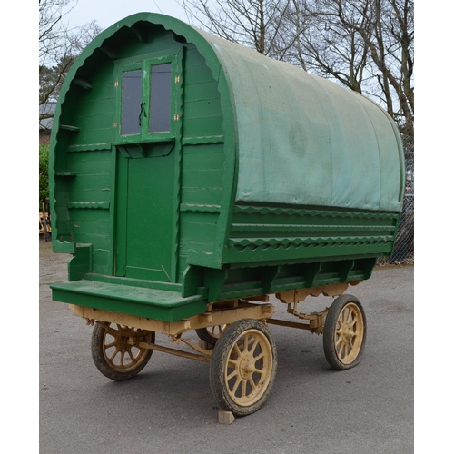 299 - Bow top gypsy caravan with green canvas roof, ornate floral tapestry to underside of roof, currently... 