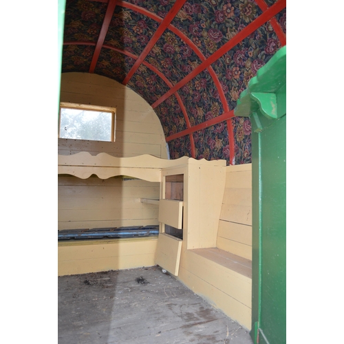 299 - Bow top gypsy caravan with green canvas roof, ornate floral tapestry to underside of roof, currently... 