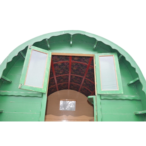 299 - Bow top gypsy caravan with green canvas roof, ornate floral tapestry to underside of roof, currently... 