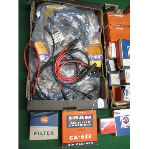 30 - Two boxes of assorted new old stock filters and spark plug leads