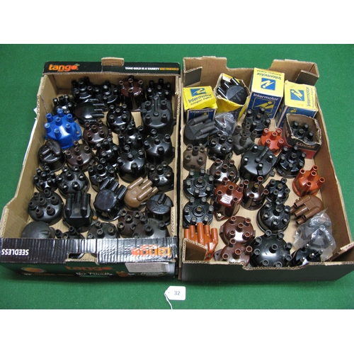 32 - Two boxes of approx fifty five assorted mostly new old stock distributor caps for 4, 6 and 8 cylinde... 