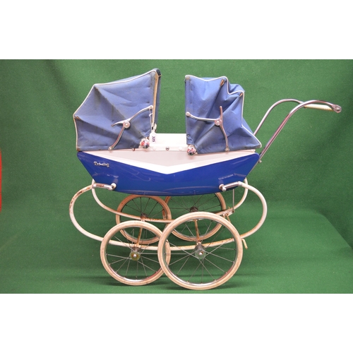 325 - Large blue and white sprung twins pram badged for Triang with two hoods and cover together with two ... 