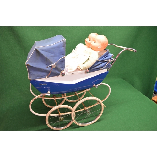 325 - Large blue and white sprung twins pram badged for Triang with two hoods and cover together with two ... 