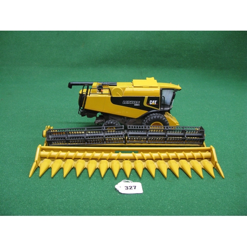 327 - Metal and plastic Cat Lexion 590R combine made by Norscot Group Inc-USA together with Britains Newho... 