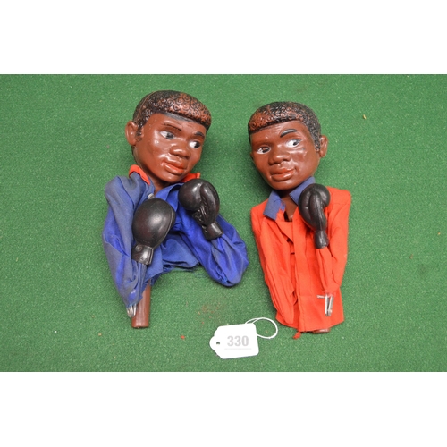 330 - Two boxed Pelham Puppets to comprise: Noddy and Golliwog, two plastic and metal boxing hand puppets,... 