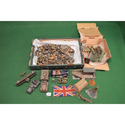 336 - Two boxes of Elastolin military figures and battlefield accessories together with two trucks, a bipl... 