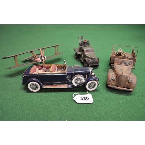 336 - Two boxes of Elastolin military figures and battlefield accessories together with two trucks, a bipl... 