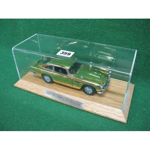 359 - Danbury Mint diecast and plastic model of James Bond's Aston Martin DB5 in gold with many moving par... 