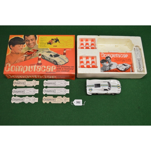 382 - Mettoy Computacar set containing a Ford GT 40, sixteen programme cards, six road markers and instruc... 