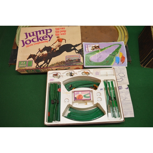 383 - Quantity of Triang Jump Jockey electric steeplechasing games to include: boxed, loose and fixed to a... 