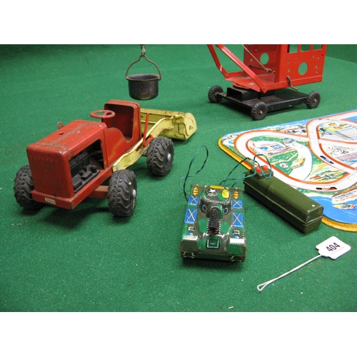 404 - Tinplate to include: German Roadway panel, Triang wheeled crane and loading shovel together with a M... 