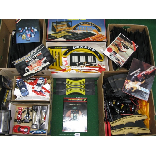 410 - Five boxes of Scalextric to include: track, accessory set, barriers, bridges, catalogues and eight c... 