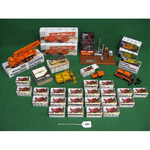 441 - Quantity of metal construction site models made in Germany by NZG and comprising: three truck mounte... 