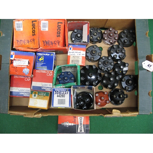 47 - Box of boxed and loose 4, 6 and 8 cylinder engine distributor caps together with a few Champion spar... 