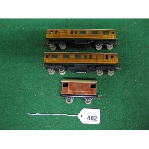 482 - Two 1930's/1940's Trix Twin Railway tinplate gloss teak brake 3rd coaches together with NE brake van... 