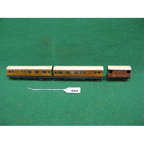 482 - Two 1930's/1940's Trix Twin Railway tinplate gloss teak brake 3rd coaches together with NE brake van... 