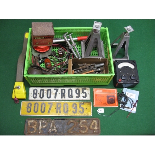 62 - Crate of items to include: four adjustable axle stands, an Avometer with instructions, oil cans, spa... 