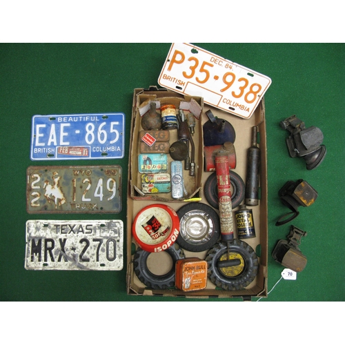 70 - Box of assorted product tins, ashtrays, number plates etc together with three old bicycle lamps and ... 