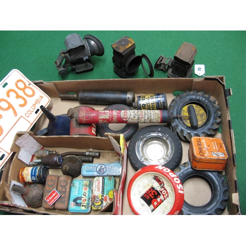 70 - Box of assorted product tins, ashtrays, number plates etc together with three old bicycle lamps and ... 