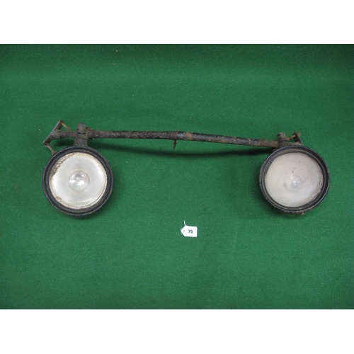 75 - Front axle and pair of headlamps possibly from a pre-war Riley