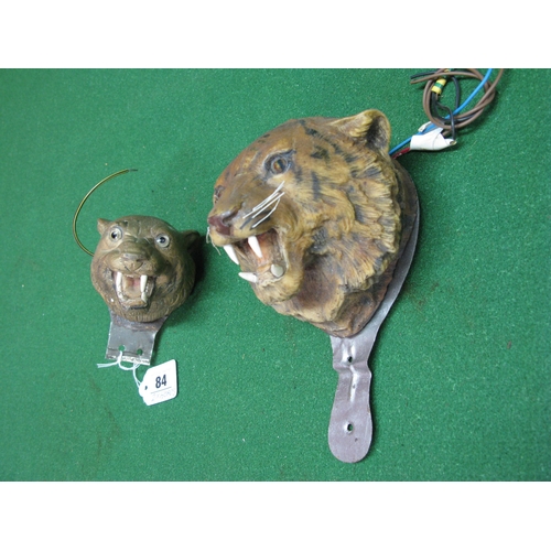 84 - Two novelty plastic big cat heads whose eyes light up when affixed to the front of your car!