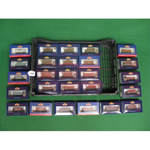 534 - Twenty boxed unused Bachmann OO four wheel open and covered wagons, guards vans, tanker, cattle truc... 