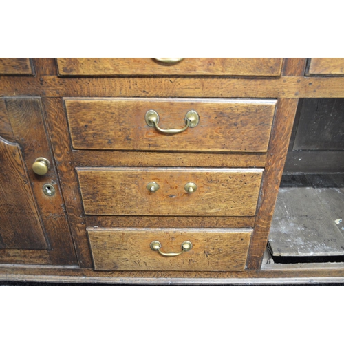 32 - Oak dresser having canopy three shelf top, the lower shelf over row of five short drawers, having wi... 