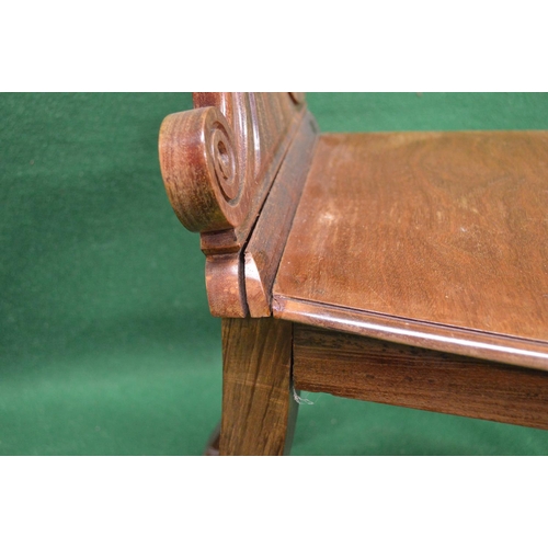 50 - Pair of 19th century hall chairs having shaped solid backs over solid seats, standing on turned legs