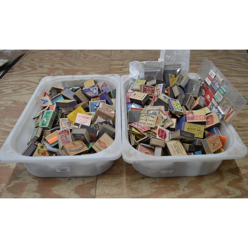 233 - Two boxes containing a collection of matchboxes
