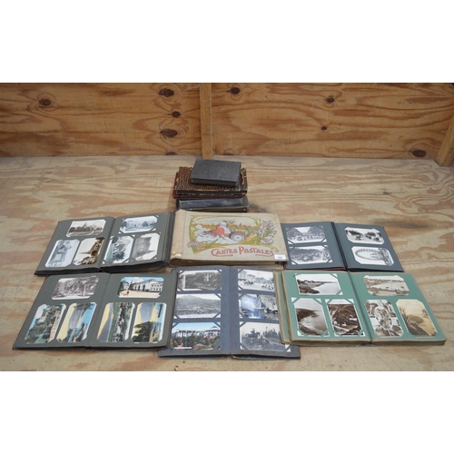 241 - Ten postcard albums containing postcards of mixed subjects to include: churches, animals and landsca... 