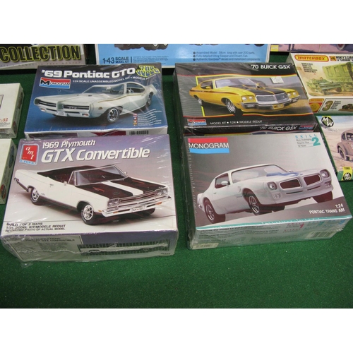 452 - Eleven unmade plastic kits of road vehicles by Airfix, Matchbox, AMT/Ertl, Military wheels and Monog... 