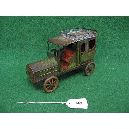 455 - Clockwork tinplate model of a Veteran car with opening rear doors, spoked wheels and roof luggage ra... 