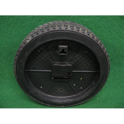 53 - Modern plastic battery wall clock in the form of an alloy wheel and tyre - 10.5