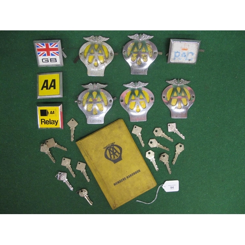 94 - Seven AA badges, square GB and RAC badges, AA members handbook cover and fourteen box keys