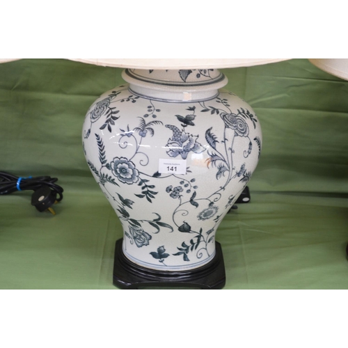 141 - Pair of blue and white porcelain table lamps with shades - 23.25