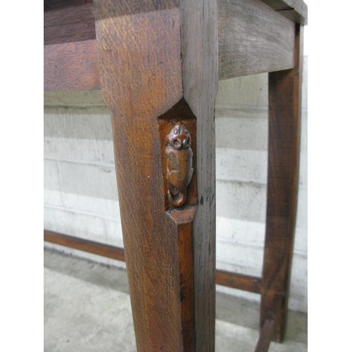 323 - Tall side table having rectangular top supported on chamfered square moulded stretchered legs, one l... 