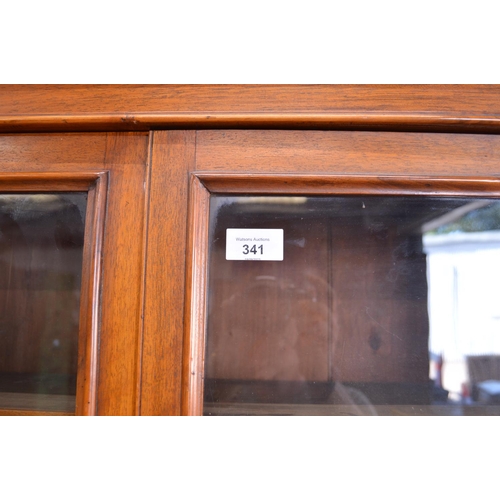 341 - Walnut glazed bookcase on cupboard - 34.75