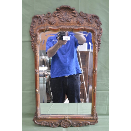 215 - Gilt framed wall mirror with shell motif's - 16.25