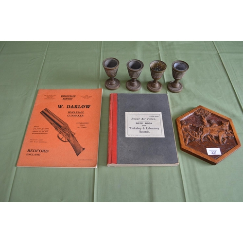 227 - Four pieces of brass Trench Art together with a PoW wood carving, RAF notebook and Firearms Wholesal... 