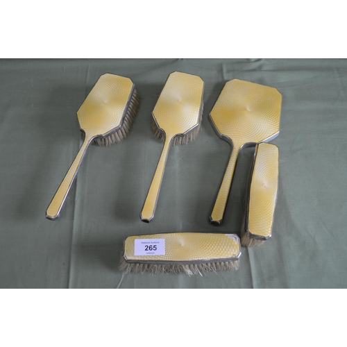 265 - Silver dressing table set with yellow enamel backs to comprise: hand mirror, two hair brushes and tw... 