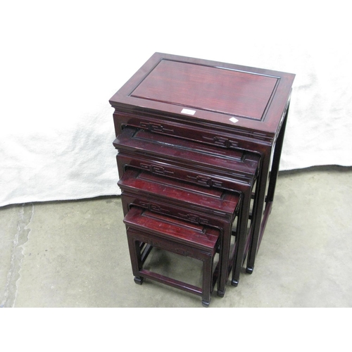 405 - Oriental style lacquered nest of four tables