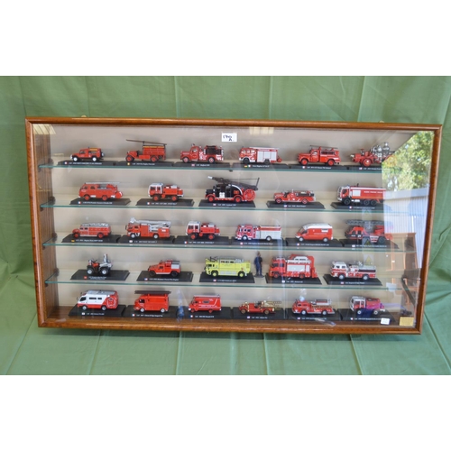 170A - Wall mounted display case containing twenty eight model fire engines from around the world and one f... 